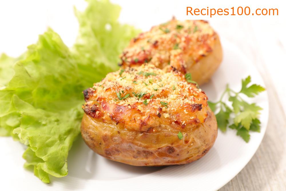 Baked potatoes with cheese, leek, ham, and pork neck