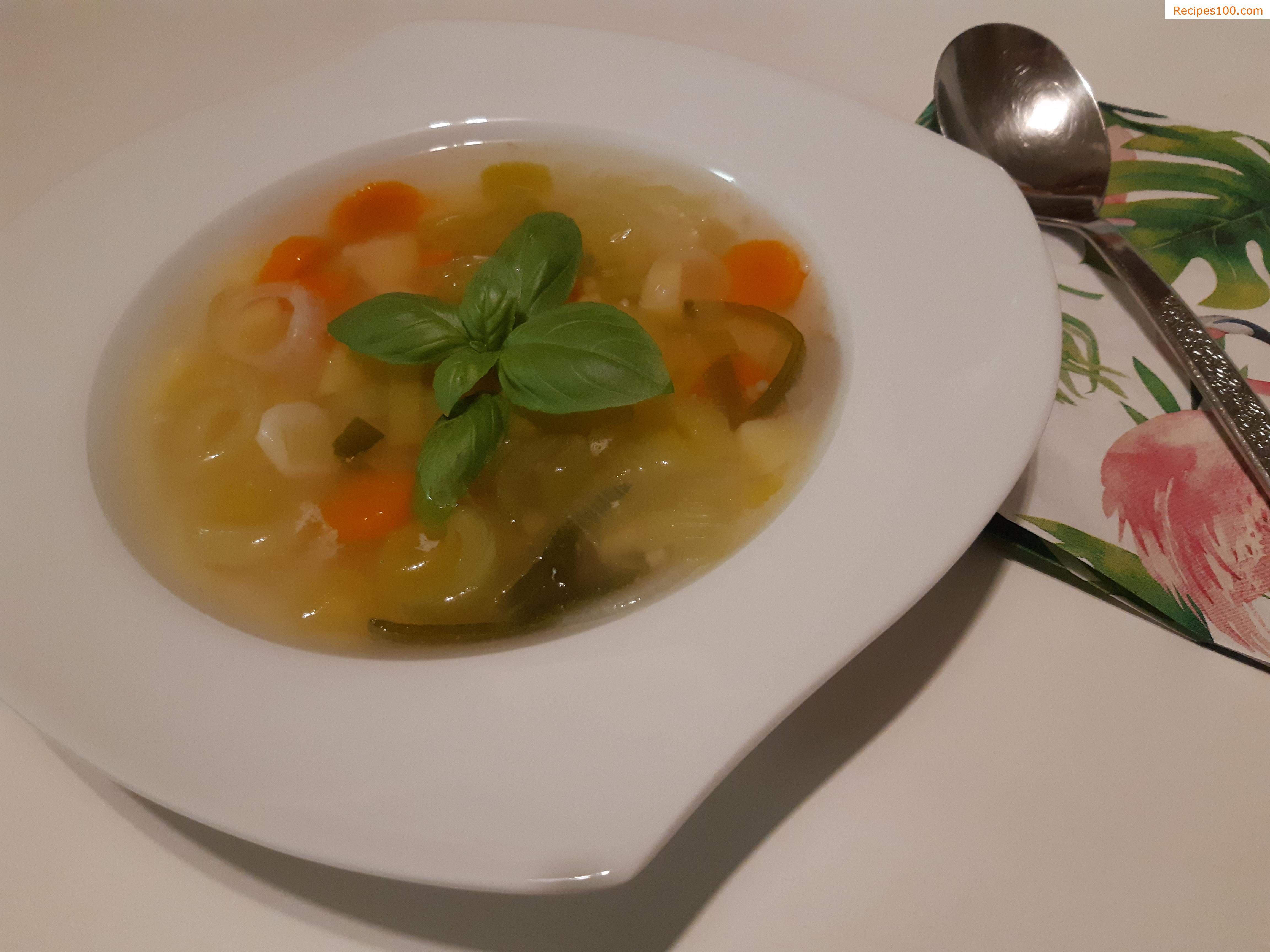 Chicken meat from the soup on fresh vegetables in a wok
