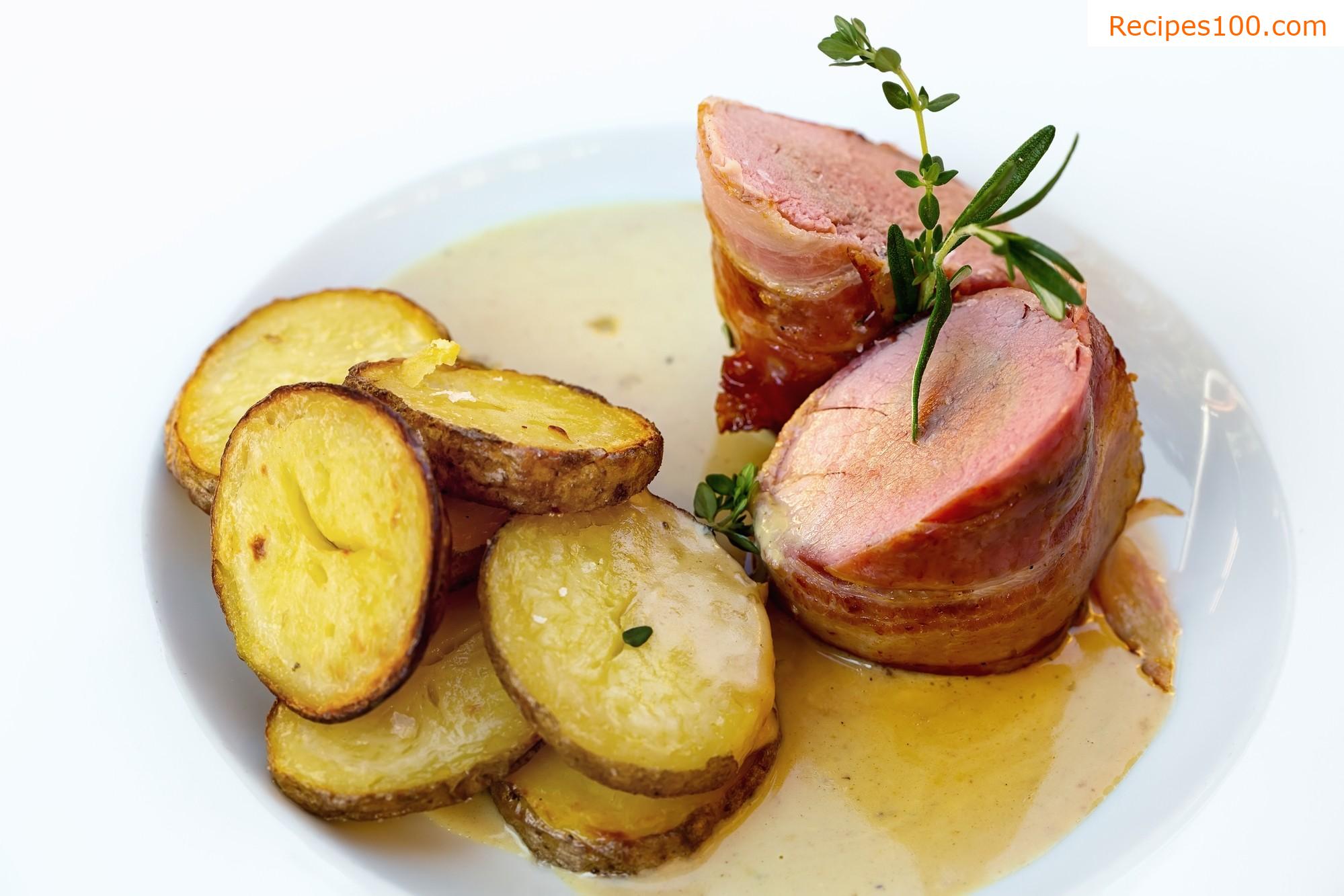 Doll in Black Forest ham with roasted potatoes