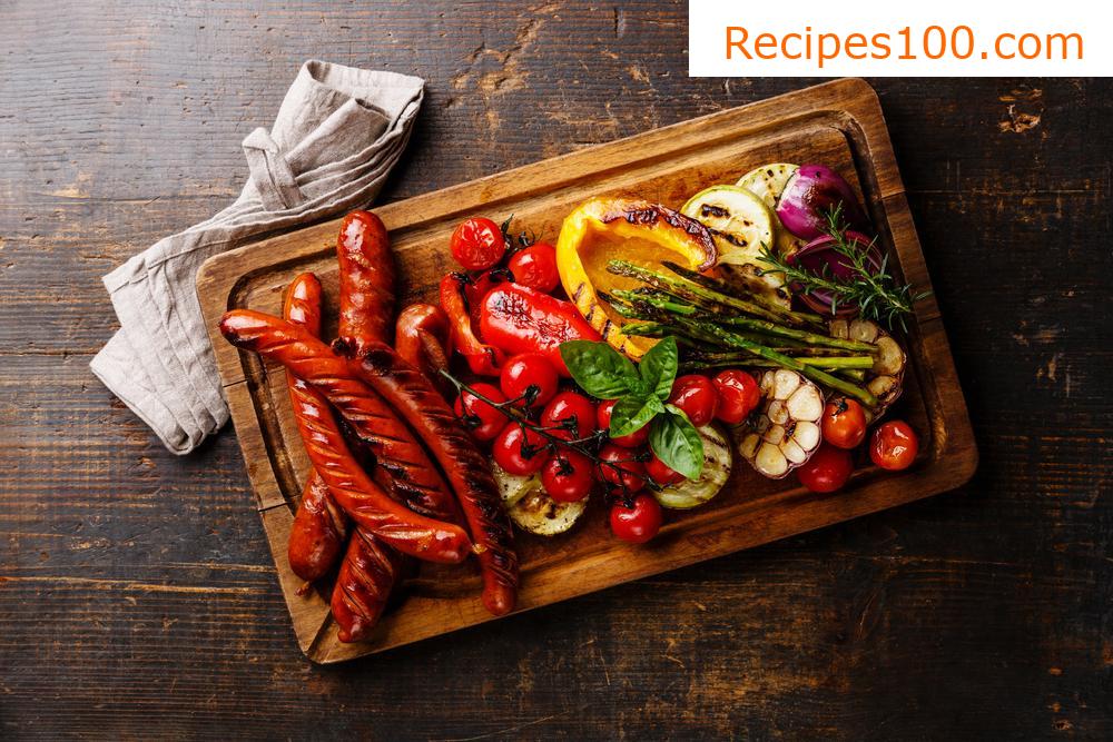 Pork leg with vegetables and sausage