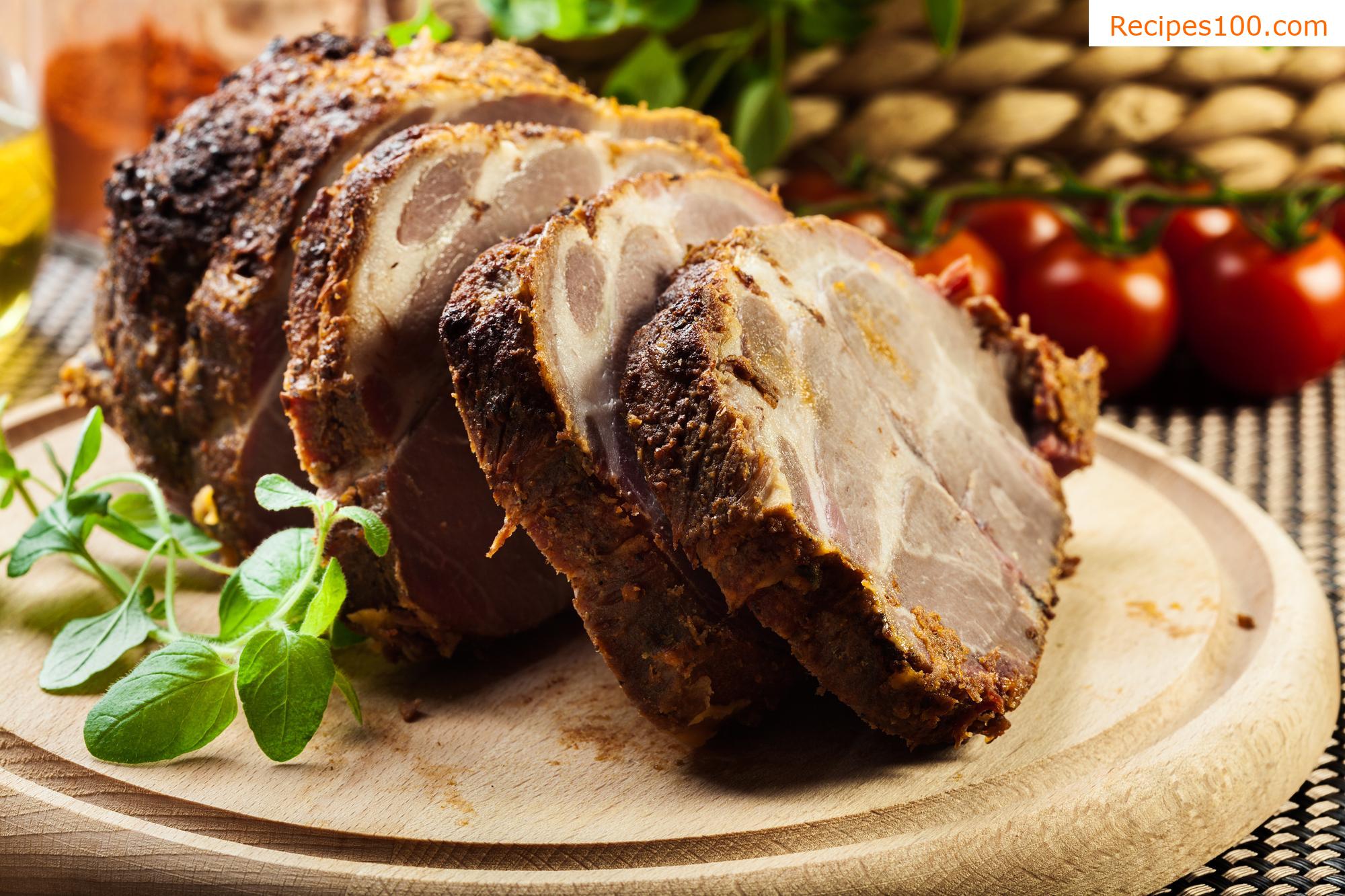 Pork neck roasted on potatoes