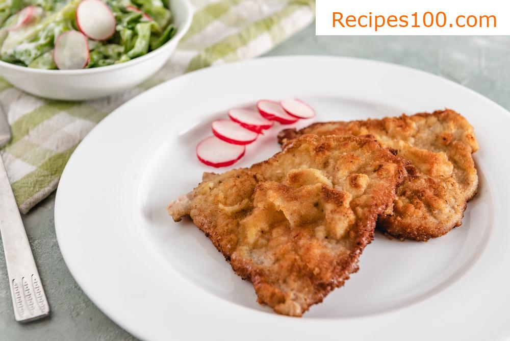 Pork schnitzel from neck fillet fried in ghee