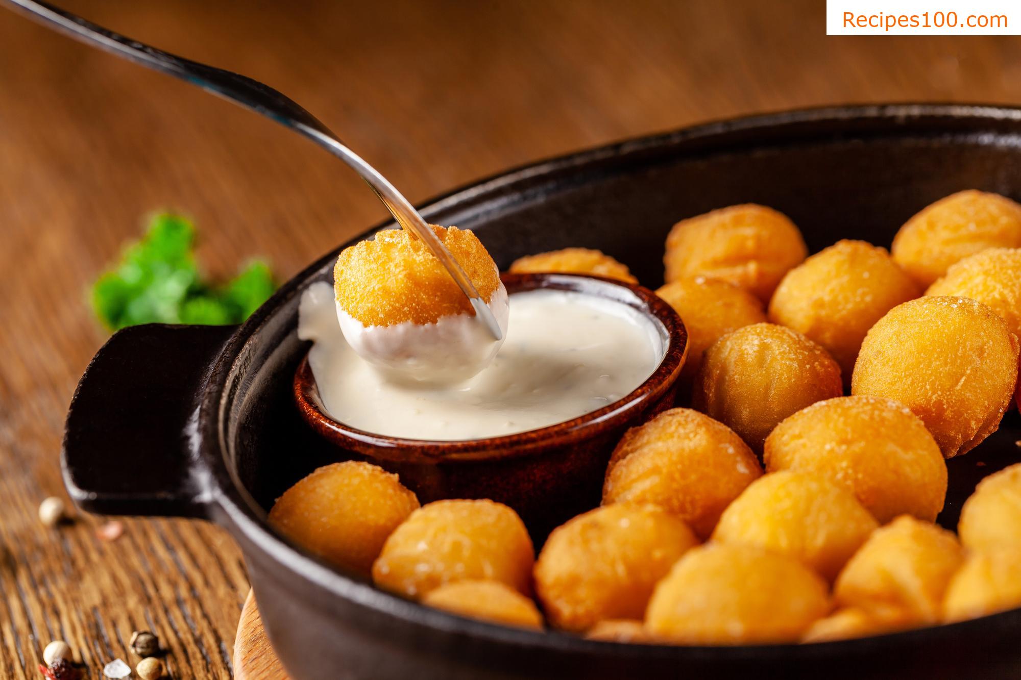 Potato croquettes with fried onions and cheese