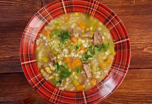 Barley soup with smoked meat and vegetables